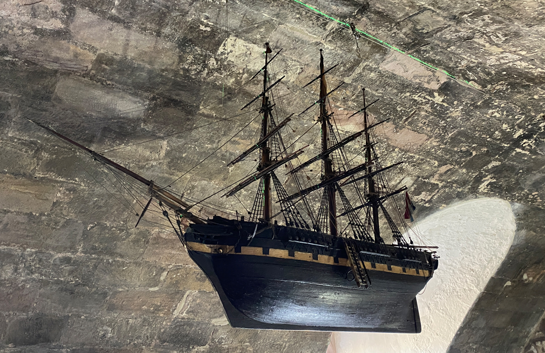 The model of The Henrietta dating from around 1840 needed to be carefully re-­‐hung in the Ship Room at Lindisfarne Castle using a wire pulley system.